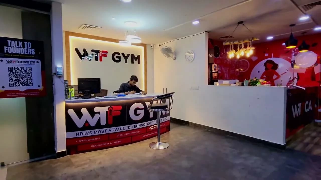 WTF Gym front desk and reception counter with a staff member at work
